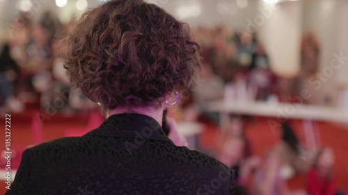 Female speaker presenting at business conference