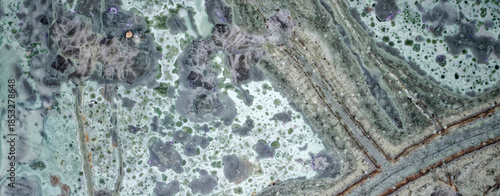 A macro photograph of Tinguaite from Khibiny under a microscope, a rare igneous ornamental stone is an abstract geological texture for science, education, research
