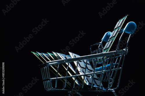 Close up of laptop ddr memory modules in shopping cart isolated on black background