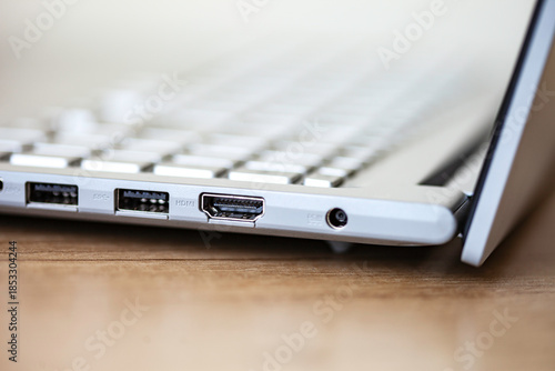 Keyboard of laptop and ports closeup.