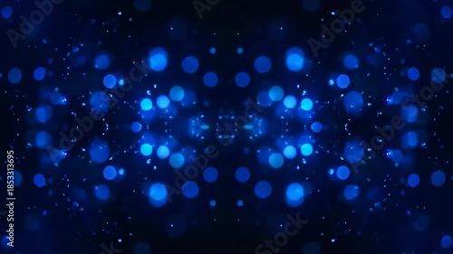 Abstract shimmering blue bokeh lights and sparkling particles symmetrically mirrored in a dark digital background