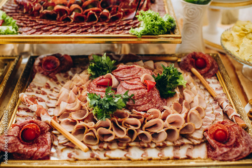 Tableau sur toile Assorted deli cold cuts platter on golden tray