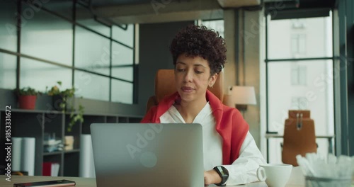 Focused professional analyzing financial documents carefully