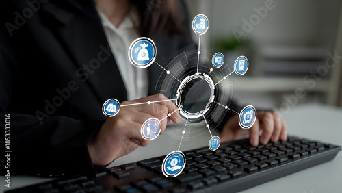 A business professional interacting with a modern digital interface while typing on a keyboard. This image represents innovation and integration in technology and finance. Crux