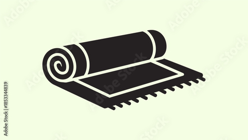 A simple black and white illustration of a rolled-up rug with a fringed edge on a light green background.