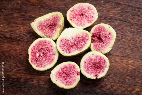 Fresh Cut Figs with Pink Flesh on Rustic Wood