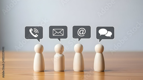Wooden figures with gray contact icons in speech bubbles symbolizing communication and support options