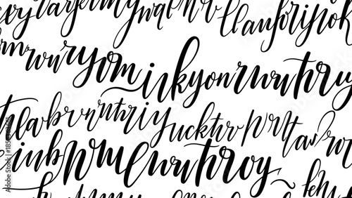 A close-up, black and white abstract pattern of cursive handwriting, featuring a dense arrangement of flowing, calligraphic letters and words.