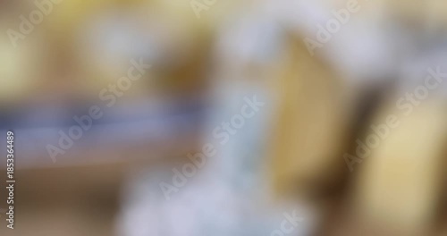 an old spoiled orange cheese with a lot of colorful mold, an inedible and dangerous cheese that was spoiled during the improper storage, the cheese is covered with mold