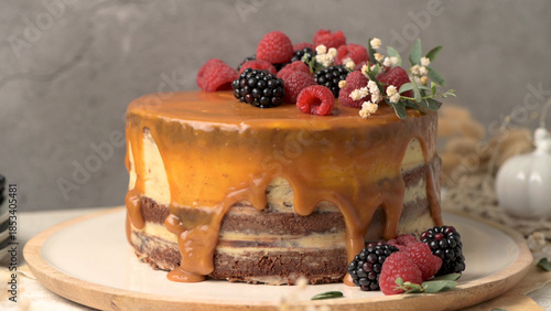 Layered Cake with Caramel Drip and Fresh Mixed Berries