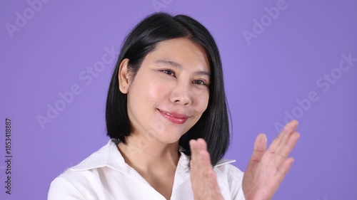 Wallpaper Mural Smiling Woman Clapping Hands with Positive Expression on Purple Torontodigital.ca