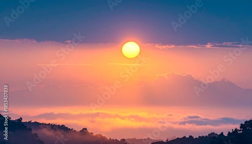 Sunrise over misty mountains