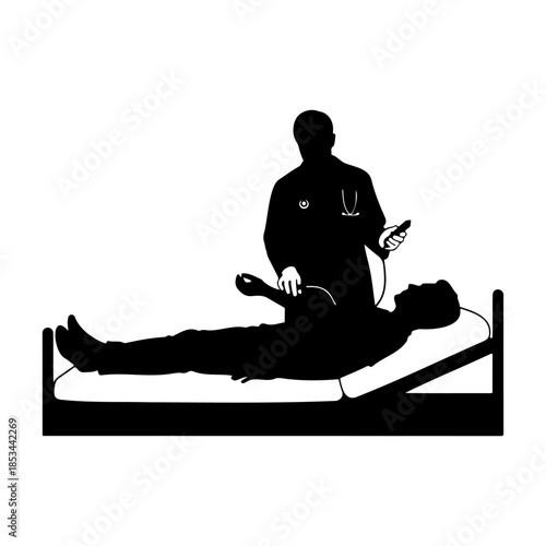 Medical professional performing defibrillator treatment on patient in hospital bed