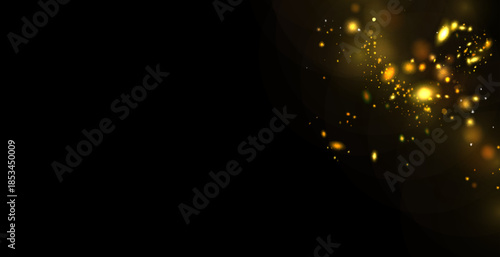 Golden sequins glow with many lights. Glittering dust. Luxurious background of golden particles