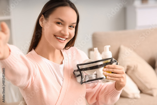 Young woman with cosmetic b...