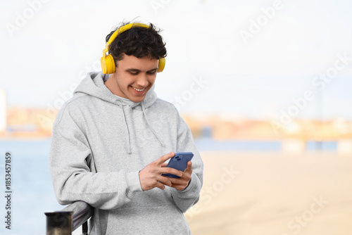 Young man in grey hoodie wi...