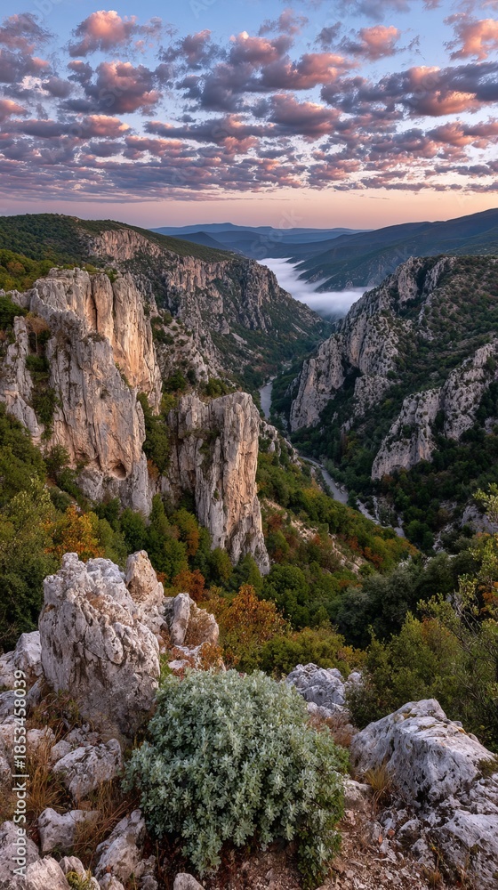Fototapeta premium Majestic canyon sunrise with mist-filled valley and dramatic colorful sky, cinematic landscape photography in pink and teal tones