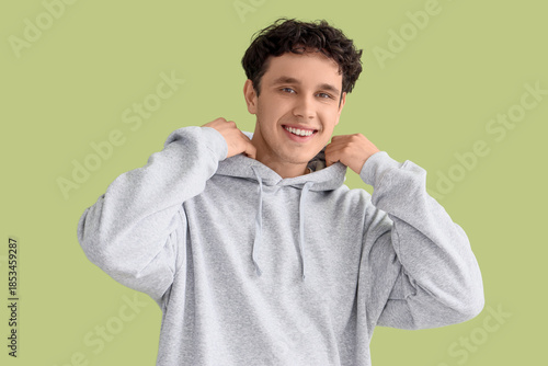 Young man in grey hoodie on...