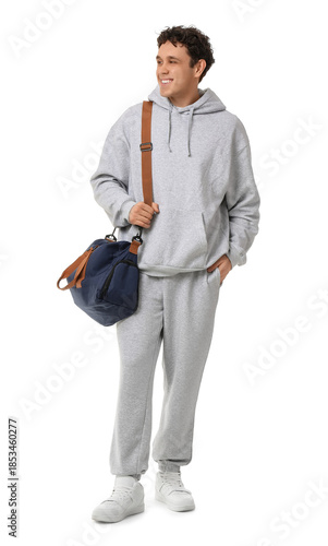 Young man in grey sports su...