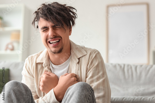 Young man having panic atta...