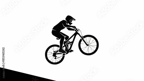 Silhouette of a mountain biker performing a jump on a white background.