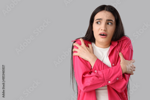 Portrait of scared young wo...