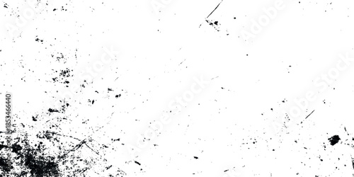 A textured abstract background featuring dark smudges and light scratches across a largely white surface