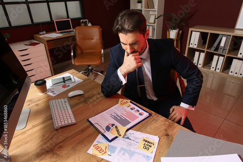 Angry businessman with clip...
