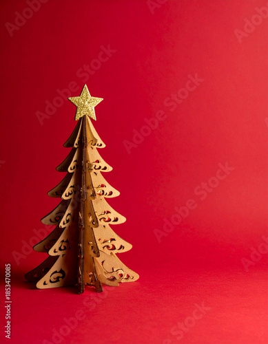 Paper Cut Christmas Tree with Golden Star on Red Background