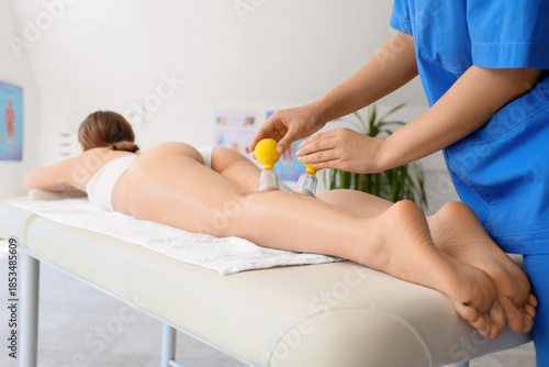 Young woman getting anti-ce...