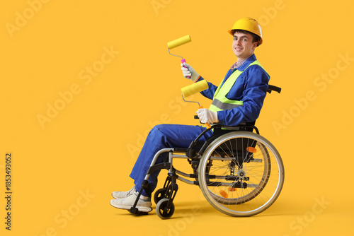 Male worker in wheelchair w...