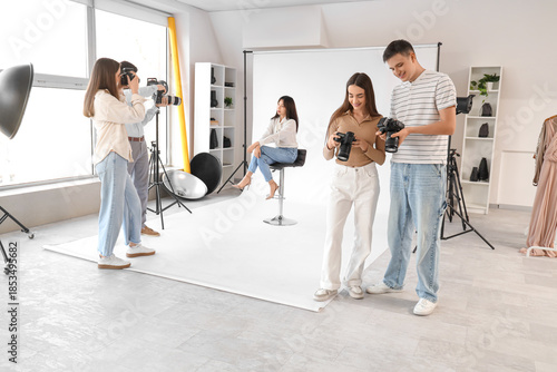 Photographers with cameras ...