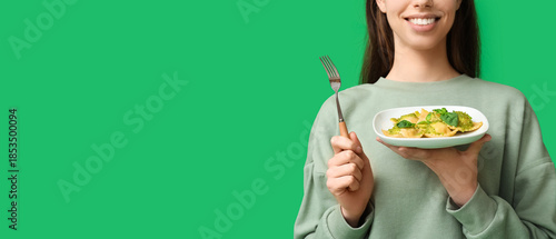 Young woman with plate of t...