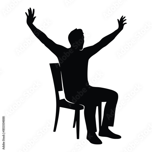 Man sitting in chair with arms raised in celebration