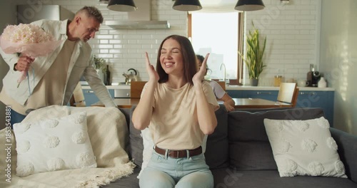 Family celebration unfolding with tears and joy in modern lounge