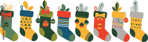 A Christmas stocking filled with colorful pencils and ribbons hanging as a festive holiday decoration