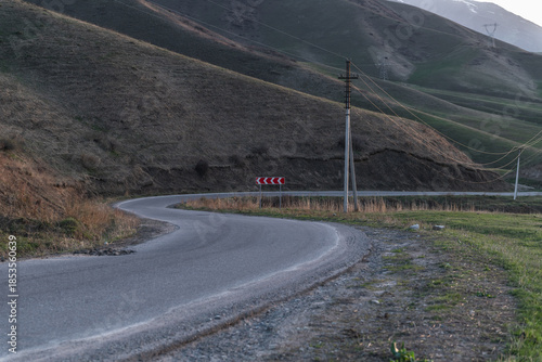 A winding road through the mountains. A concept of life's journey, inviting exploration and adventure in the beauty of nature.