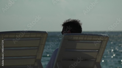 Beach Vacation Relaxing Man Texting Phone Vertical video