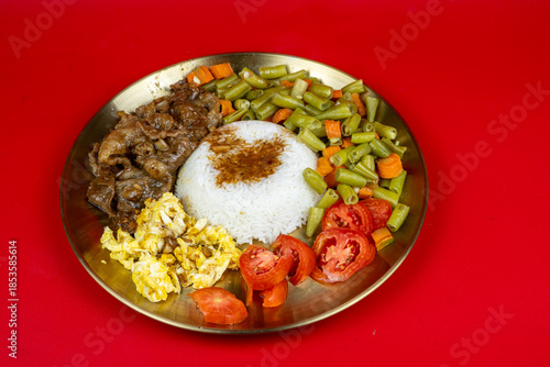 Traditional Asian Meal with Rice and Vegetables on Red Background