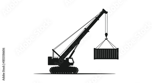 A striking black silhouette of a construction crane lifting a shipping container industrial power
