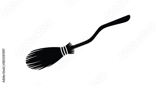 A simple black silhouette of a classic witchcraft broom elegantly poised in mid air silhouette