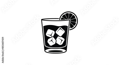 A refreshing glass of dark liquid with ice cubes and a citrus slice a striking silhouette