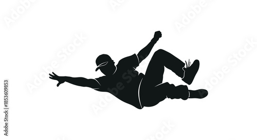 A dynamic figure captured mid air in a joyful pose creating a striking silhouette
