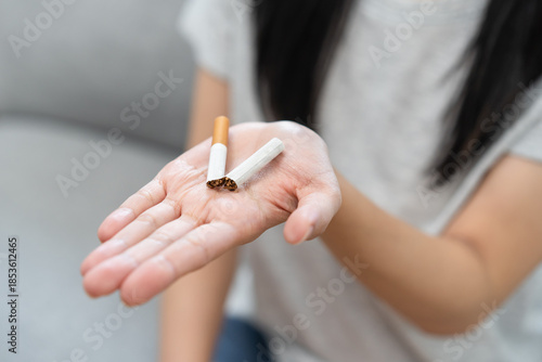 Obraz na płótnie Quit smoke, No smoking health care concept, addiction asian young woman, girl refuse cigarette, smoker quitting smoke, hand in broken, holding break tobacco