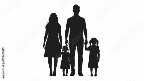 Silhouette of a happy family with two young children standing together.