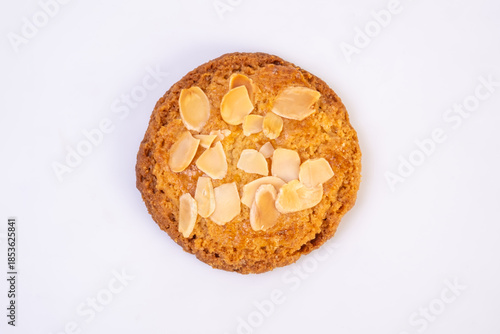 Traditional almond cookies with almond flakes on white background. Image on top view.