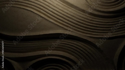 Cinematic shadows over raked sand texture.