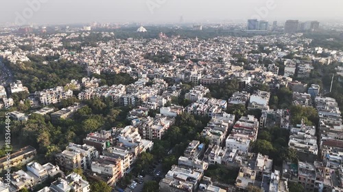 Wallpaper Mural Drone shot of Nehru Place Metro corridor, highlighting modern public transport infrastructure amid tree-lined roads, mixed-use developments, and steady city traffic in South Delhi, India. Torontodigital.ca