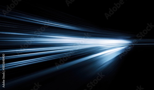 Streaks of bright light zoom across a dark background, evoking speed and motion