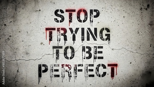 Motivational Quote Against Perfectionism on Grungy Wall
